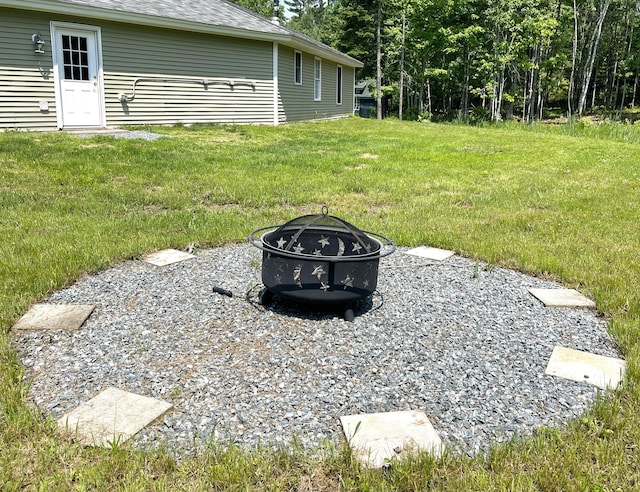 32 Low Hill Ln, Fletchers Landing Twp, ME 04605 - view of grassy yard featuring an outdoor fire pit