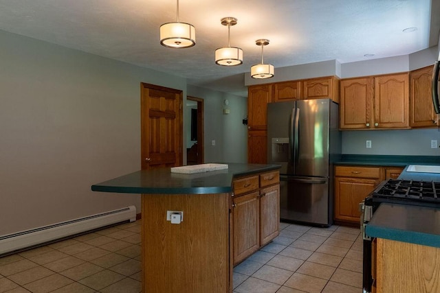 3350 Middle Rd, Sidney, ME 04330 - kitchen with stainless steel appliances, light tile patterned floors, dark countertops, and a baseboard radiator