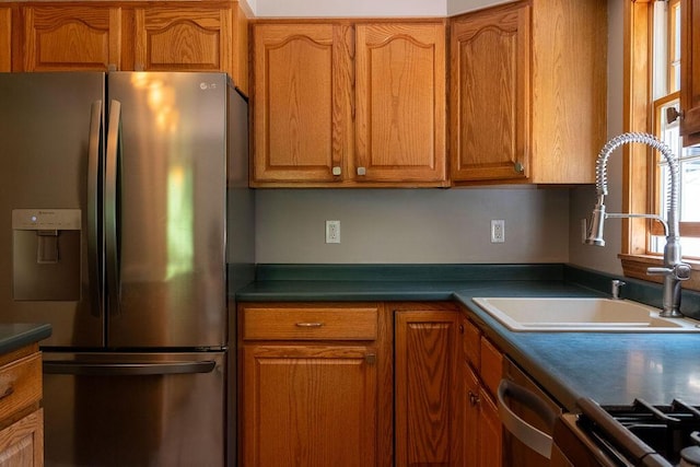 3350 Middle Rd, Sidney, ME 04330 - kitchen with stainless steel appliances, brown cabinets, and dark countertops