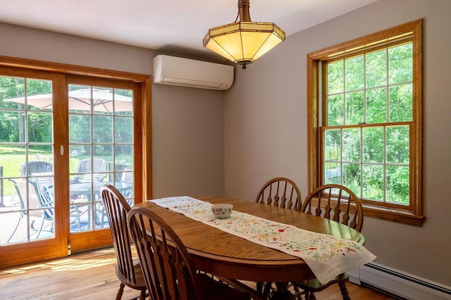 3350 Middle Rd, Sidney, ME 04330 - dining room with a wall mounted AC, a baseboard heating unit, and light wood-type flooring