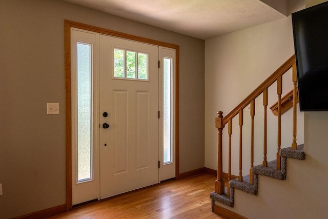 3350 Middle Rd, Sidney, ME 04330 - foyer entrance featuring light wood-style floors and stairway