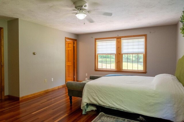 3350 Middle Rd, Sidney, ME 04330 - bedroom with dark wood-type flooring and ceiling fan