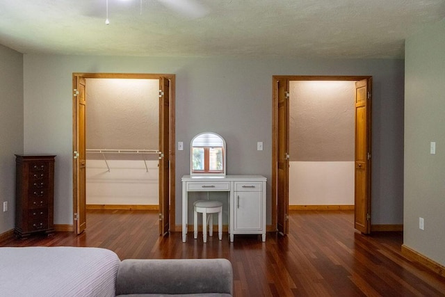 3350 Middle Rd, Sidney, ME 04330 - bedroom featuring dark wood finished floors, a walk in closet, a closet, and a ceiling fan