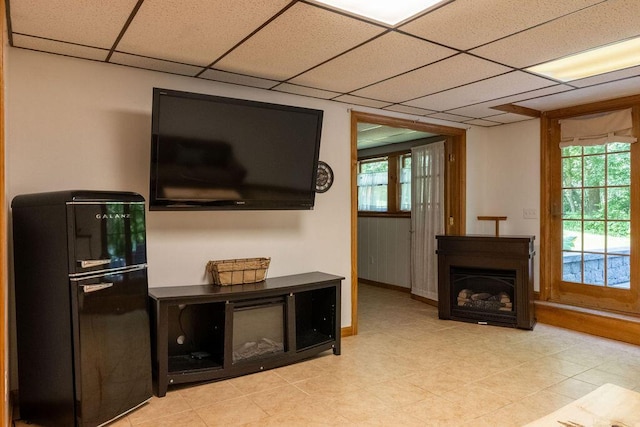 3350 Middle Rd, Sidney, ME 04330 - living area featuring a drop ceiling and light tile patterned floors