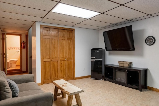 3350 Middle Rd, Sidney, ME 04330 - living area featuring light tile patterned floors and a drop ceiling