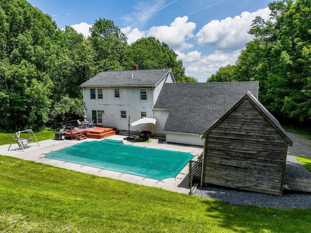 3350 Middle Rd, Sidney, ME 04330 - rear view of house with a deck, a yard, a covered pool, and a patio