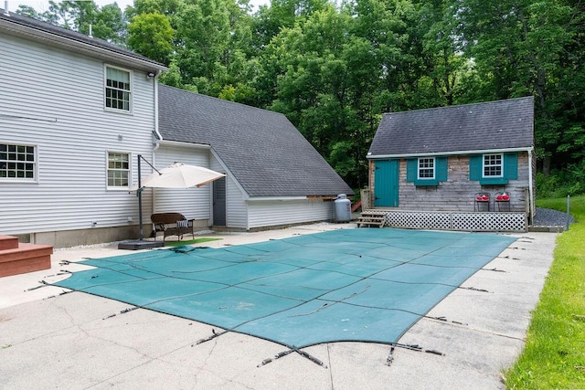 3350 Middle Rd, Sidney, ME 04330 - view of pool featuring a covered pool, an outbuilding, and a patio