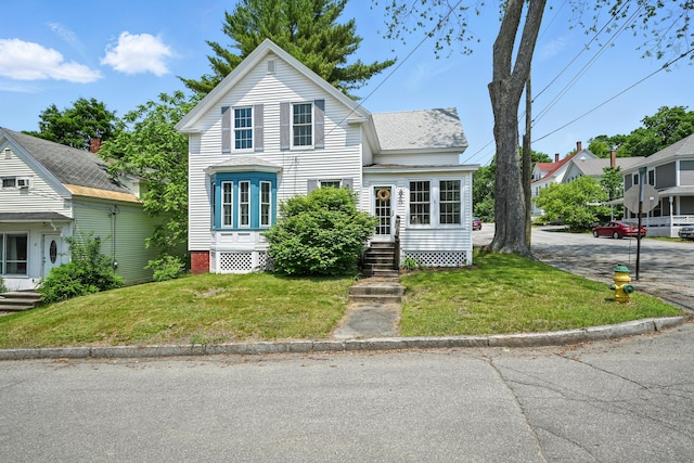 14 Maple St, Lisbon, ME 04252 - traditional-style house with a front yard