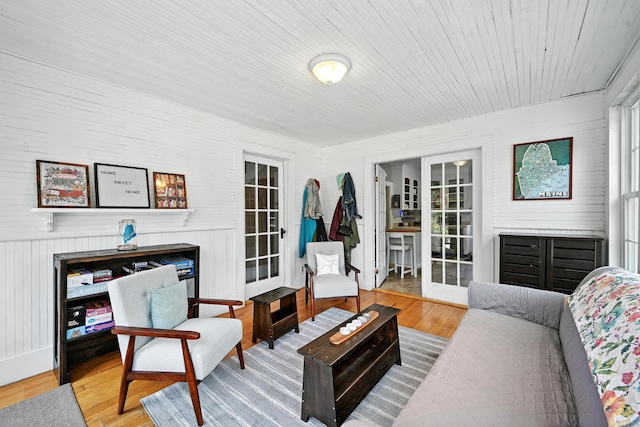 14 Maple St, Lisbon, ME 04252 - living area with wood finished floors, french doors, and wooden ceiling