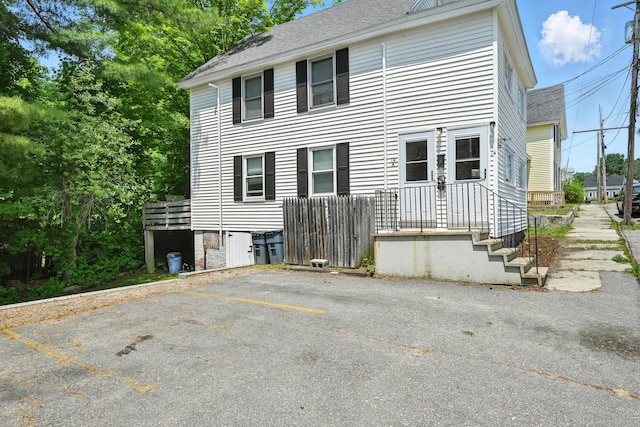 14 Maple St, Lisbon, ME 04252 - view of front of house featuring a shingled roof and uncovered parking