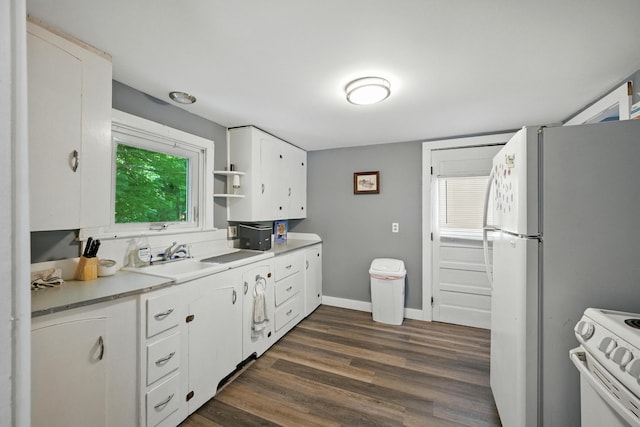 14 Maple St, Lisbon, ME 04252 - kitchen featuring white appliances, white cabinetry, dark wood-type flooring, light countertops, and open shelves