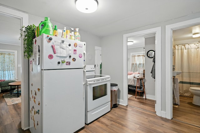 14 Maple St, Lisbon, ME 04252 - kitchen with white appliances and wood finished floors