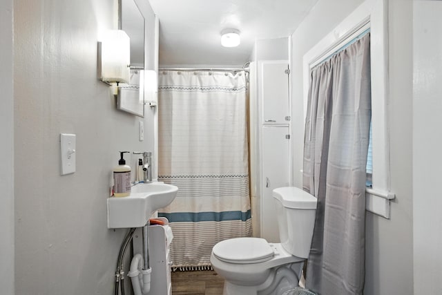 14 Maple St, Lisbon, ME 04252 - full bathroom with wood finished floors and a shower with curtain