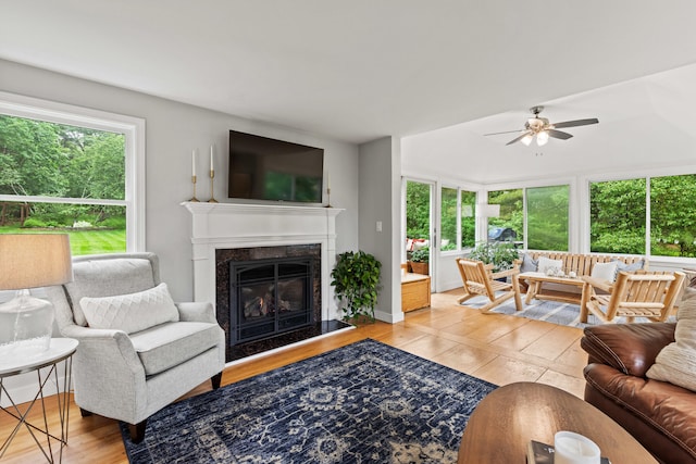 526 E Main St, Yarmouth, ME 04096 - living area featuring light wood finished floors, ceiling fan, and a premium fireplace