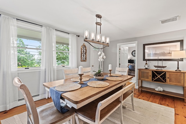 526 E Main St, Yarmouth, ME 04096 - dining room with wood finished floors and a chandelier