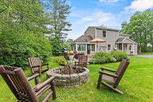 526 E Main St, Yarmouth, ME 04096 - rear view of property with a fire pit, a yard, and a wooden deck