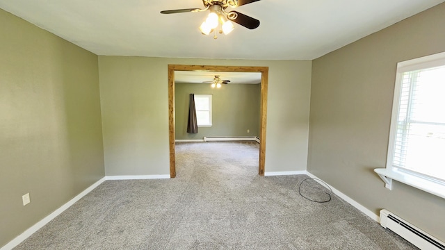 50 George Wright Rd, Woolwich, ME 04579 - carpeted spare room with a baseboard radiator and a ceiling fan