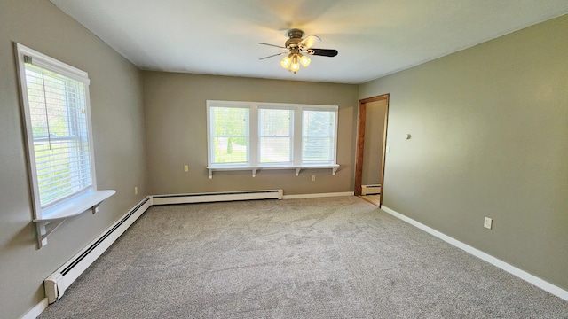 50 George Wright Rd, Woolwich, ME 04579 - unfurnished room with baseboard heating, healthy amount of natural light, a ceiling fan, and a baseboard heating unit