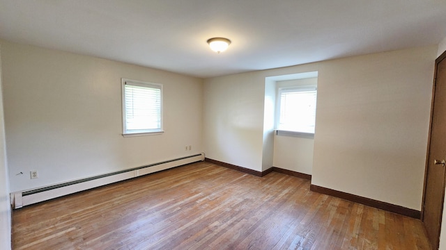 50 George Wright Rd, Woolwich, ME 04579 - unfurnished room with a baseboard heating unit and wood finished floors