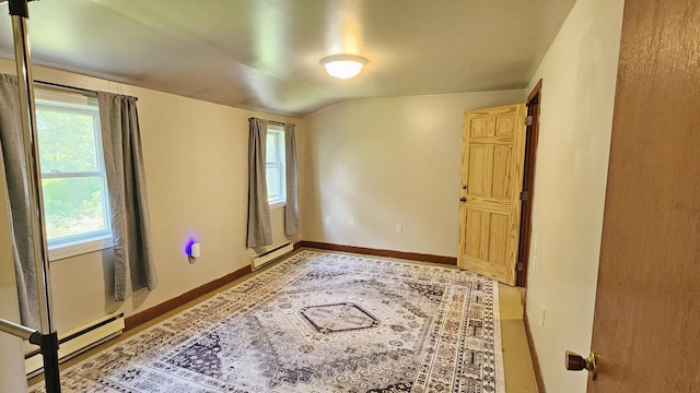 50 George Wright Rd, Woolwich, ME 04579 - unfurnished room with a baseboard heating unit, plenty of natural light, and vaulted ceiling