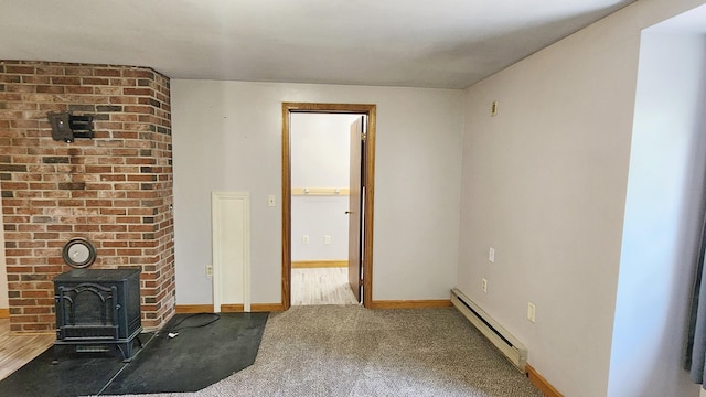 50 George Wright Rd, Woolwich, ME 04579 - unfurnished living room featuring baseboard heating, carpet floors, and a wood stove