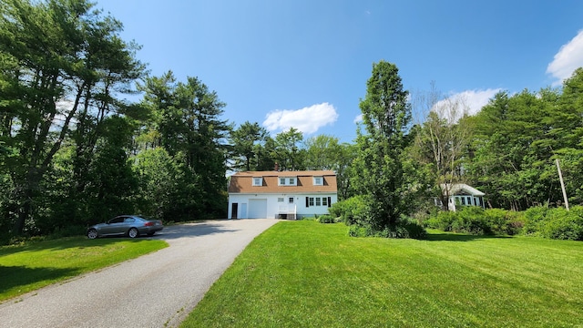 50 George Wright Rd, Woolwich, ME 04579 - view of front facade with a garage, driveway, a front yard, and a gambrel roof