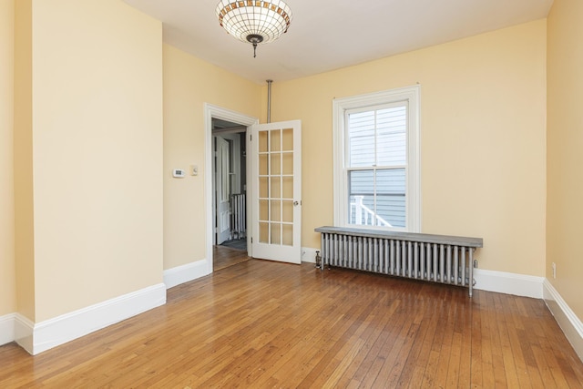 80 Melbourne St, Portland, ME 04101 - unfurnished room with radiator and hardwood / wood-style floors
