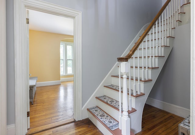 80 Melbourne St, Portland, ME 04101 - staircase with arched walkways and wood-type flooring