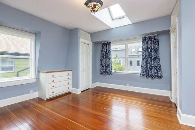 80 Melbourne St, Portland, ME 04101 - empty room featuring a skylight and hardwood / wood-style flooring