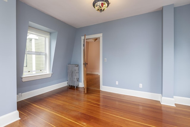 80 Melbourne St, Portland, ME 04101 - spare room with radiator heating unit and wood finished floors