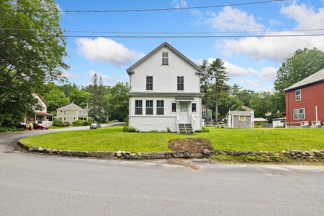 33 Maple St, Limerick, ME 04048 - traditional-style house featuring a front lawn and an outdoor structure