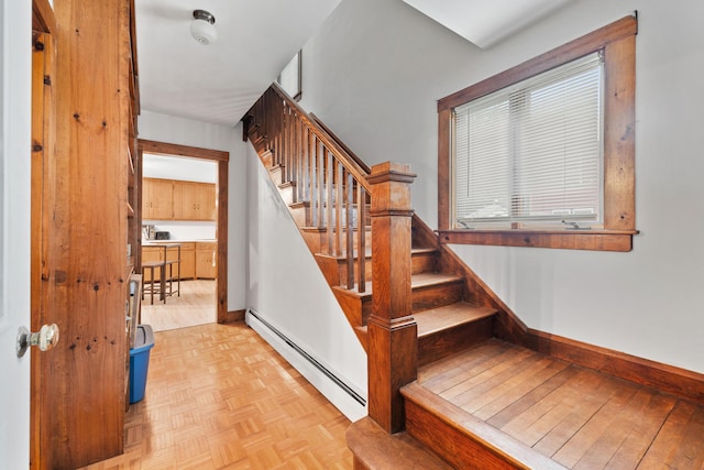 33 Maple St, Limerick, ME 04048 - staircase featuring a baseboard heating unit and baseboards