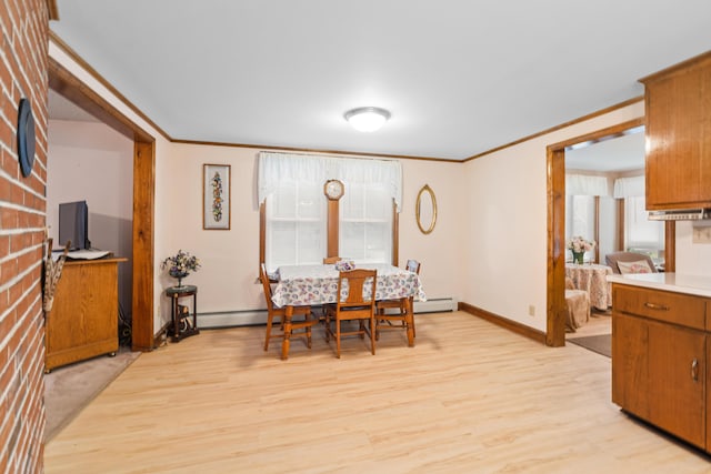 33 Maple St, Limerick, ME 04048 - dining space featuring ornamental molding, light wood finished floors, plenty of natural light, and a baseboard heating unit