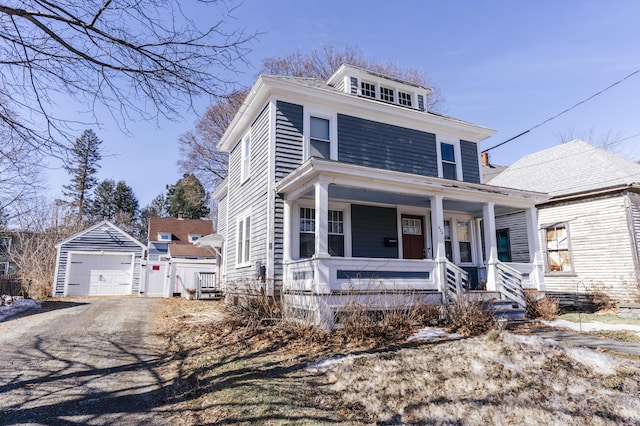 272 Center St, Bangor, ME 04401 - american foursquare style home featuring a porch, an outdoor structure, driveway, and a garage