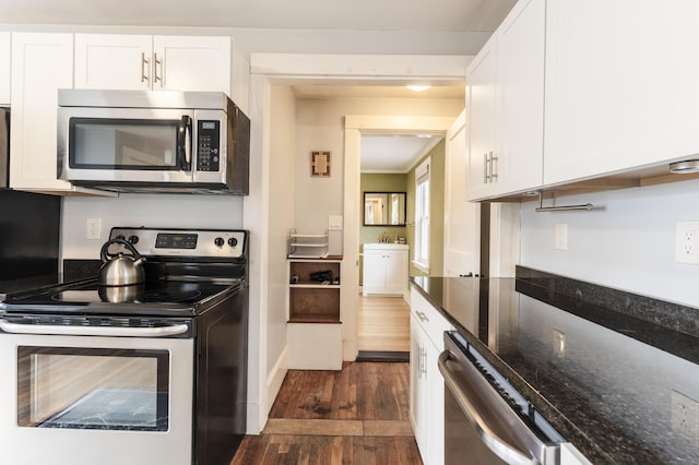 272 Center St, Bangor, ME 04401 - kitchen featuring stainless steel appliances, dark wood finished floors, white cabinets, and dark stone countertops