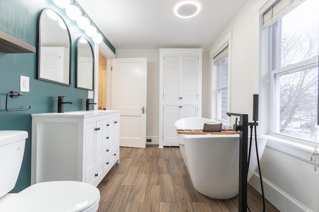 272 Center St, Bangor, ME 04401 - full bathroom with a freestanding bath, vanity, and healthy amount of natural light