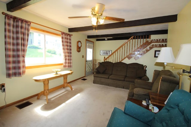 28 Charles St, Belfast, ME 04915 - carpeted living area with beamed ceiling, stairway, and ceiling fan