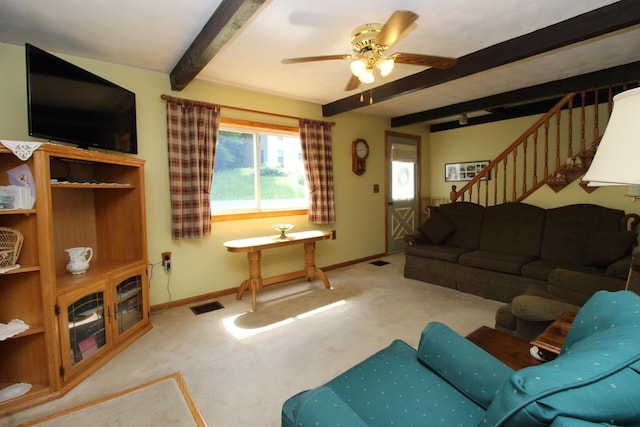 28 Charles St, Belfast, ME 04915 - living area featuring beam ceiling, carpet, stairs, and a ceiling fan