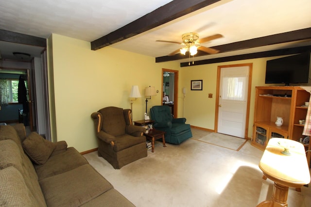 28 Charles St, Belfast, ME 04915 - living area featuring beamed ceiling, carpet floors, and ceiling fan