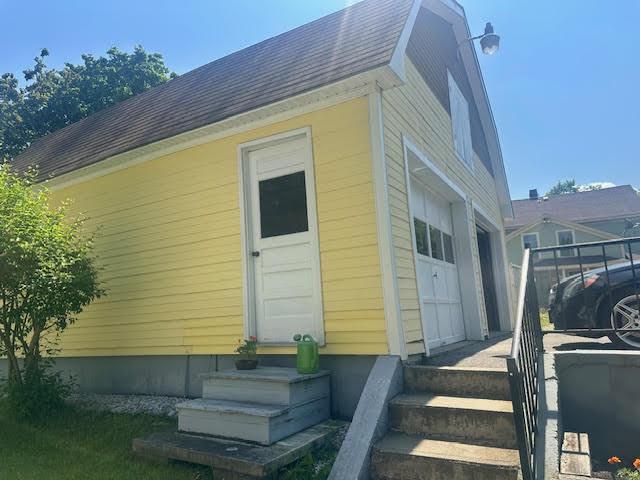 28 Charles St, Belfast, ME 04915 - view of property exterior with entry steps and a shingled roof