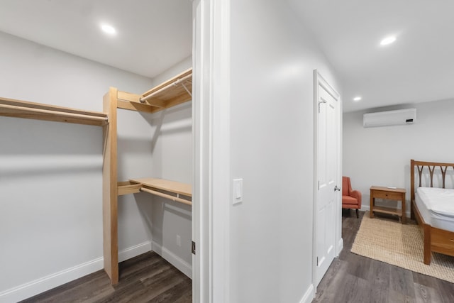 701 Wallston Rd, Saint George, ME 04860 - spacious closet featuring a wall mounted AC and dark wood-type flooring
