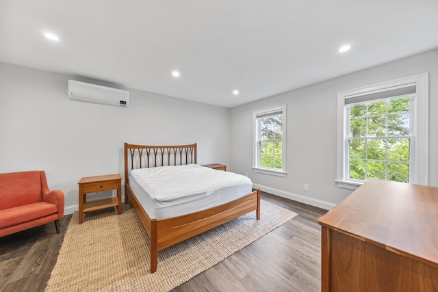 701 Wallston Rd, Saint George, ME 04860 - bedroom featuring a wall mounted air conditioner, wood finished floors, and recessed lighting