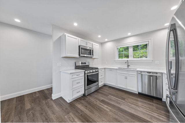 701 Wallston Rd, Saint George, ME 04860 - kitchen featuring stainless steel appliances, dark wood finished floors, light countertops, recessed lighting, and white cabinets