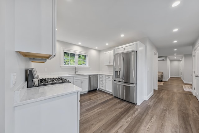 701 Wallston Rd, Saint George, ME 04860 - kitchen with stainless steel appliances, recessed lighting, light countertops, wood finished floors, and white cabinets
