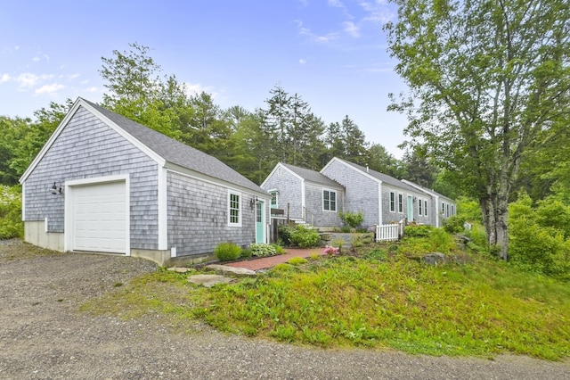 701 Wallston Rd, Saint George, ME 04860 - view of front of house featuring a garage, an outdoor structure, and driveway