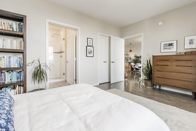 156 Sheridan St Unit 2A, Portland, ME 04101 - bedroom with wood finished floors and ensuite bath