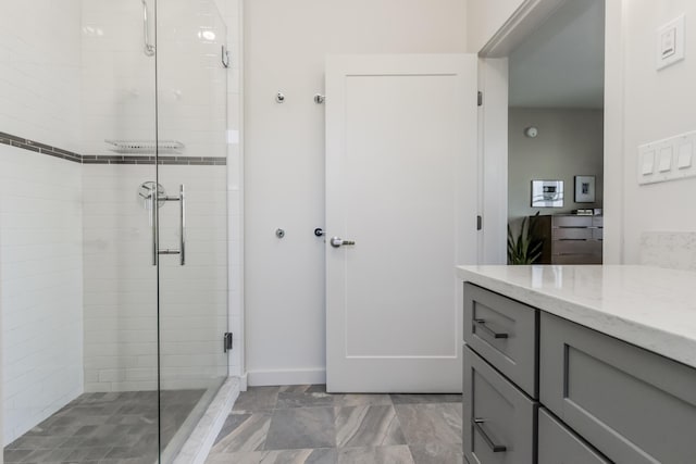 156 Sheridan St Unit 2A, Portland, ME 04101 - full bathroom featuring a stall shower, vanity, and marble finish flooring