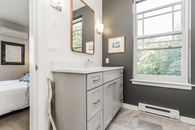 156 Sheridan St Unit 2A, Portland, ME 04101 - bathroom featuring a baseboard radiator, a wall unit AC, connected bathroom, and vanity