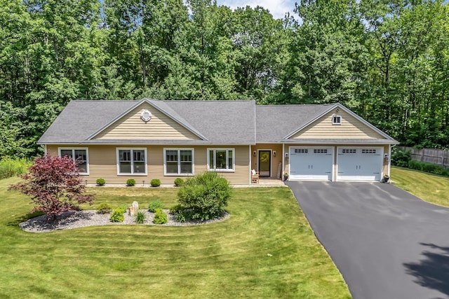 187 Hickory Dr, Auburn, ME 04210 - view of front of home with driveway, an attached garage, and a front yard