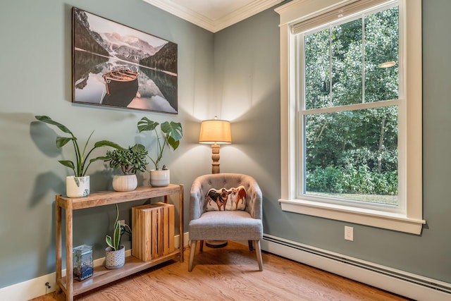 187 Hickory Dr, Auburn, ME 04210 - sitting room featuring a baseboard radiator, crown molding, and wood finished floors